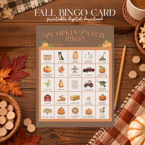 May include: A rectangular Pumpkin Patch Bingo card featuring a grid of twenty-five squares with illustrations of autumn-themed items like pumpkins, a dog, a tractor, and a barn, each labelled with text. The card has a brown border and orange background.