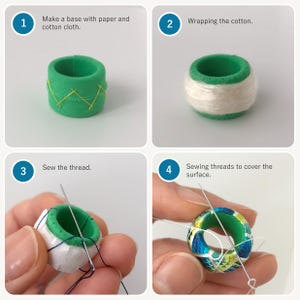May include: A four-step instructional guide for crafting a ring. Step 1: Make a base with paper and cotton cloth. Step 2: Wrapping the cotton. Step 3: Sew the thread. Step 4: Sewing threads to cover the surface. The images show a green ring base being wrapped in white cotton and then covered with blue, green, and yellow patterned thread.