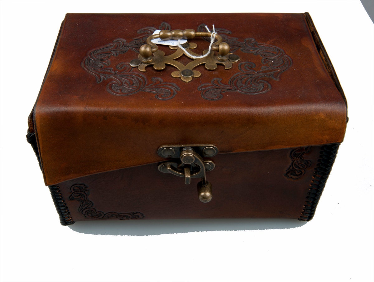 Brown leather box with embossed flourishes handle and hook closure home decorative tray victorian steampunk interior design fantasy larp bag
