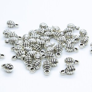 Srebrne zawieszki do łańcuszków - 8 x 4 mm z otworem 2 mm Ilość 26