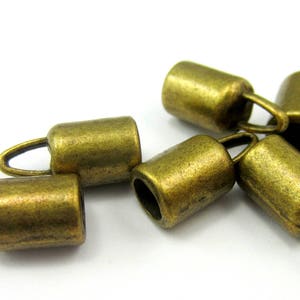 16 Cord caps Antique bronze cord ends caps bead caps barrel end caps cord end tassel caps 14mm x 6.5mm