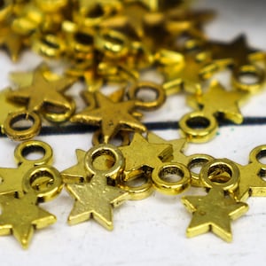 24 Star charms antique gold 10mm x 8mm bracelet charms, earring dangles, scrapbook embellishments