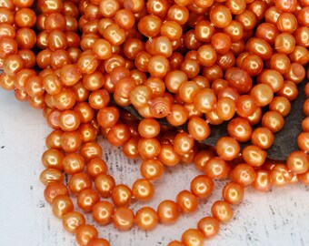 グレードAオレンジポリッシュポテトパールビーズ、温かみのある光沢の