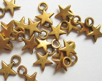 24 Star charms antique gold 10mm x 8mm bracelet charms, earring dangles, scrapbook embellishments