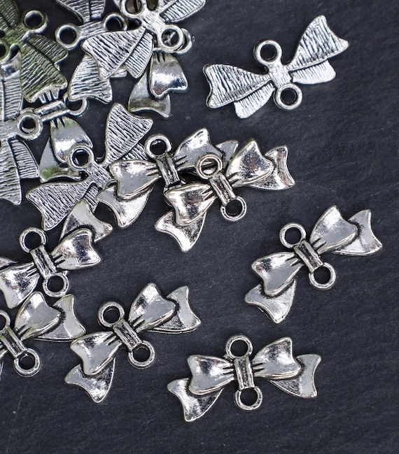 Silver bow connector charms lead safe nickel safe metal charms 20x10x3mm Qty 12