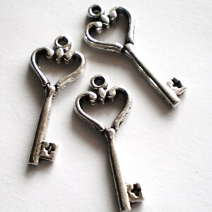 10 key charms SHK heart  silver metal 26mm 11mm