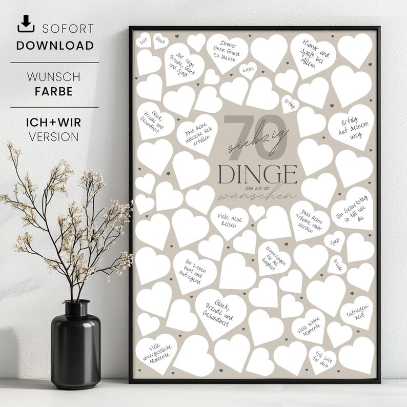 May include: A framed print with a beige background and numerous white heart shapes. The print features the text "70 Dinge die wir dir w&uuml;nschen" in the center, with handwritten wishes inside the hearts. A black vase with a plant is in the foreground.