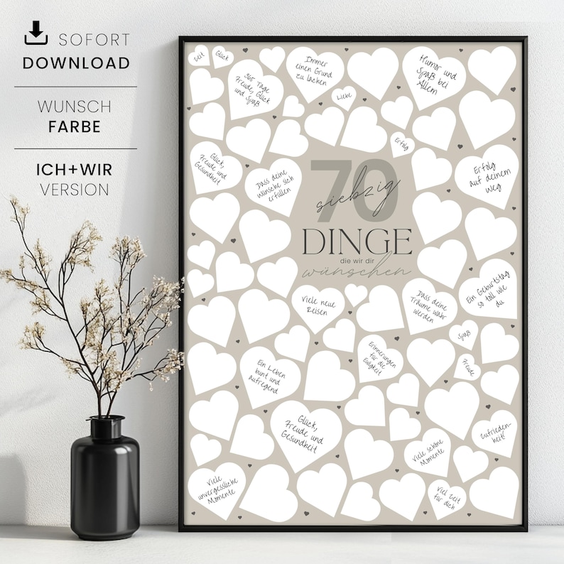 May include: A framed print with a beige background filled with white heart shapes. The print has the text "70 Things We Wish" in the center, with handwritten wishes inside the hearts. A black vase with a plant is in the foreground.