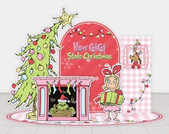 May include: A Christmas-themed display featuring a green Christmas tree with ornaments, a pink fireplace with the Grinch, and a girl holding a gift. The text "How Gigi Stole Christmas" is displayed on a red background.