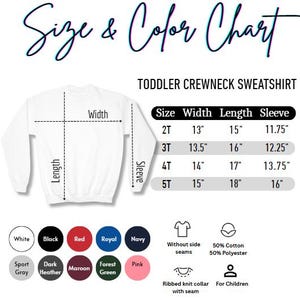May include: White toddler crewneck sweatshirt with a size and color chart. The chart lists sizes 2T to 5T, with measurements in inches for width, length, and sleeve. Color options include white, black, red, royal, and navy.