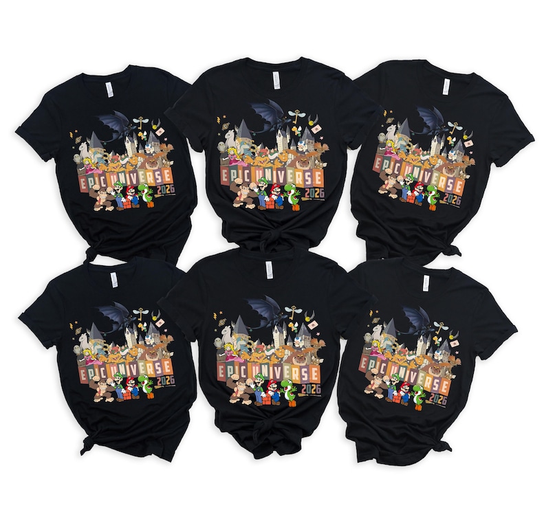 May include: Six black t-shirts with a colorful graphic featuring various cartoon characters and the text "EPIC UNIVERSE 2026". The design includes a dragon, castle, and several video game characters.