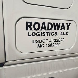 May include: White truck with a black rectangular sign that reads "ROADWAY LOGISTICS, LLC USDOT 4132878 MC 1582951"