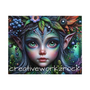 May include: A colourful jigsaw puzzle depicting a fantasy fairy with large green eyes, pointed ears, and a floral crown. The fairy's skin is a mix of blue and green hues. The puzzle has the text "creativeworkzrock" at the bottom.