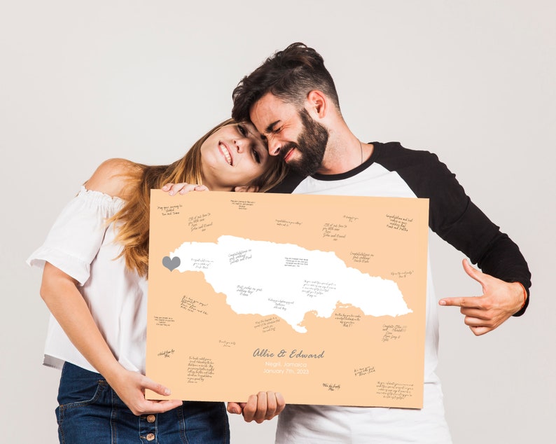 Couple with map of their wedding location that was signed by guests, gift idea for destination wedding