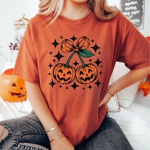 Halloween Pumpkin Cherries Sweatshirt, Coquette Bow Pumpkin Sweatshirt, Womens Halloween Gift, Cute Autumn Gift, Fall Pumpkin Sweatshirt