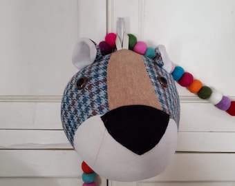 Plush taxidermy mounted bear head made from recycled wool fabrics