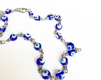 Boze oogbescherming talismanketting