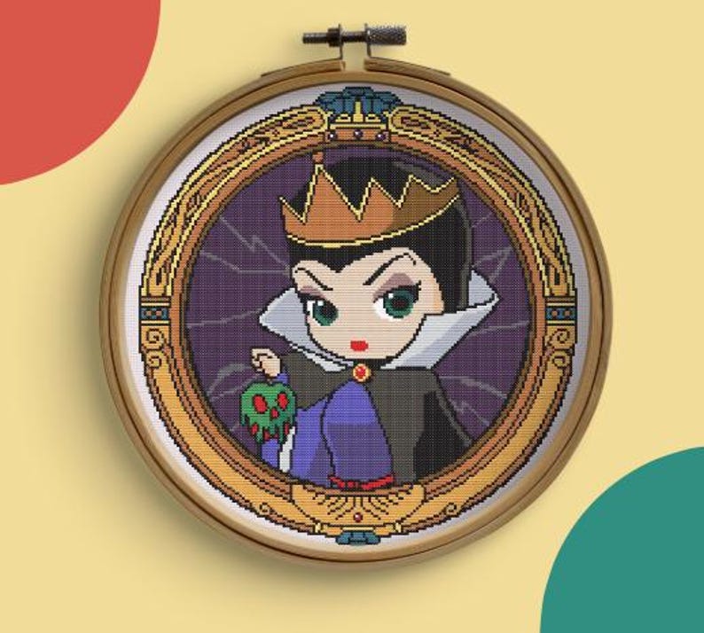 May include: A cross-stitch embroidery of a cartoon character in a wooden hoop. The character is a woman with a crown, holding a green apple. The background is purple with a gold frame.
