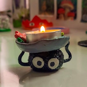 Soot sprite candle holder