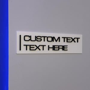May include: White rectangular sign with black text that reads "CUSTOM TEXT TEXT HERE".