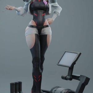 May include: A black and white anime figurine of a woman with rainbow hair, wearing a black and white jumpsuit, standing on a black base with a screen and a mechanical arm.