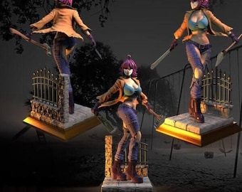 May include: A pink-haired figurine of a woman wearing a brown jacket, blue jeans, and a white mask. She is holding a weapon in each hand and is standing on a stone base with a metal fence behind her.