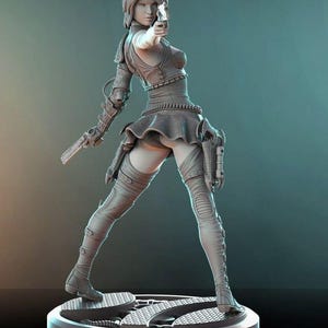 May include: A grey, detailed figurine of a woman wearing a short skirt and thigh-high boots. She is holding a gun in her right hand and has a determined expression on her face.