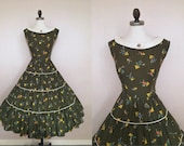 Vintage 1950s Stick Figure Farmers Novelty Print Olive Green Cotton Full Skirt Dress
