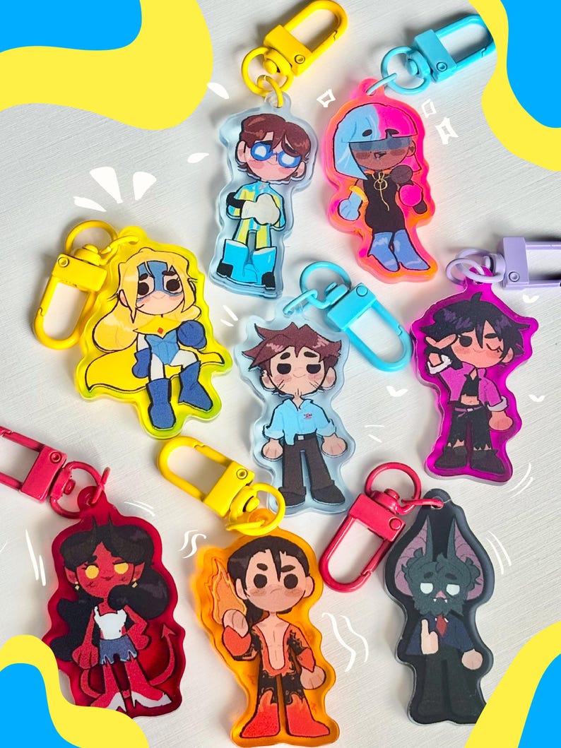 Puede incluir: Una colecci&oacute;n de llaveros acr&iacute;licos coloridos con personajes de dibujos animados con varios dise&ntilde;os. Cada llavero tiene un dise&ntilde;o de personaje &uacute;nico, con colores vibrantes y cierres met&aacute;licos en amarillo, rosa y azul.