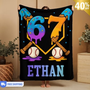 May include: Black blanket with a baseball theme. Features the number 67 in a dripping ice cream design, baseballs, and the name "ETHAN" in gradient blue. Includes baseball bats and a home plate outline.