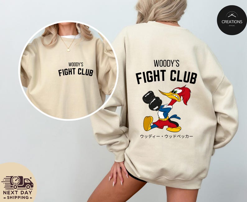 a woman wearing a sweatshirt with a cartoon character on it