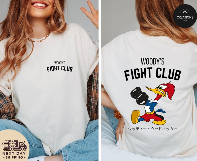 a woman wearing a woody's fight club t - shirt