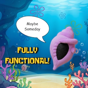 May include: A plush purple conch shell with a black mesh opening and a small circular ring attachment. The image includes a speech bubble with the text "Maybe Someday" and the yellow text "FULLY FUNCTIONAL!" set against an underwater background.