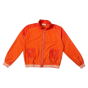 May include: Bright orange zip-up jacket with two front pockets and white stripes on the cuffs and hem. The jacket has a perforated pattern on the front and sleeves. The collar is a solid orange color.