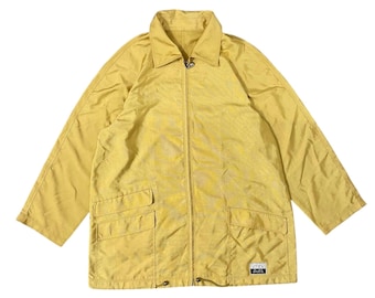 May include: A yellow jacket with a zipper closure and two pockets. The jacket has a small logo on the bottom right side that says "Sports".