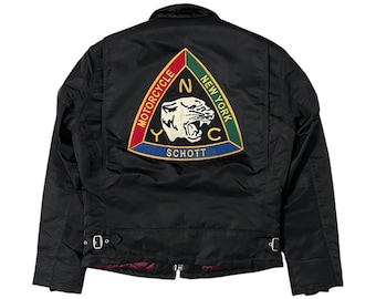May include: Black motorcycle jacket with a triangular patch featuring a panther and the text "Motorcycle New York NYC SCHOTT".