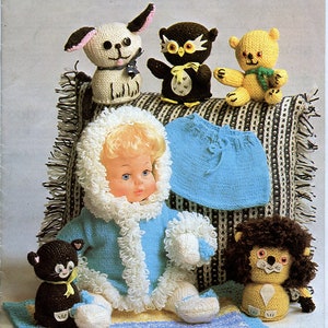 May include: A knitting pattern booklet featuring a doll wearing a blue knitted coat with a white fur trim, a black cat, a yellow teddy bear, a brown owl, a white dog, and a brown lion. The booklet is titled "Wendy Bits and Bobs 530 56p".