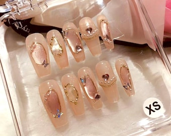 Uñas postizas en rosa ruborizado, diseño reutilizable