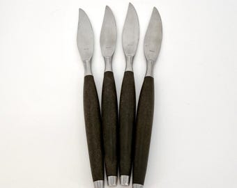 Juego de cubiertos escandinavos vintage MCM de acero inoxidable plateado y negro, fabricado en Japón.