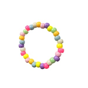 May include: A colorful beaded bracelet with pastel shades of pink, yellow, blue, and green.