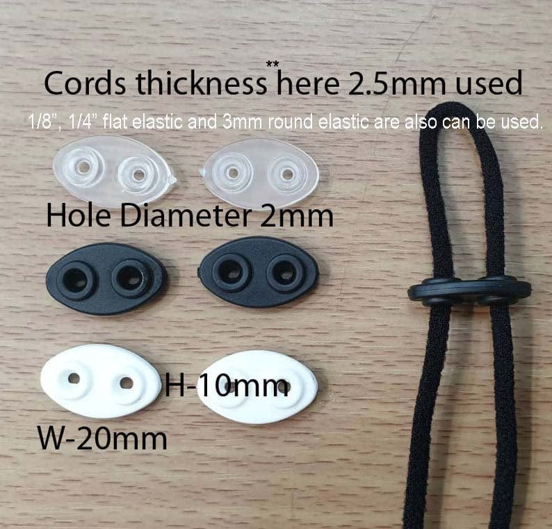 May include: Close-up of two white oval-shaped plastic toggles with two holes each. The toggles are 2 inches wide and 1 inch high. The text "W-20mm" and "H-10mm" is printed below the toggles. Two black oval-shaped plastic toggles with two holes each are shown above the white toggles. The text "Hole Diameter 2mm" is printed above the black toggles. Two clear plastic toggles with two holes each are shown above the black toggles. The text "Cords thickness here 2.5mm used" is printed above the clear toggles. The text "1/8", 1/4" flat elastic and 3mm round elastic are also can be used." is printed below the clear toggles. A black cord with two black toggles is shown on the right side of the image.