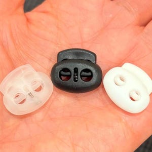 Plastic Oval Cord Locks - Flat Double Hole Spring Toggles for Drawstrings, Bean Shape 2 Hole String Stopper for Face Masks, Hoodies, Jackets