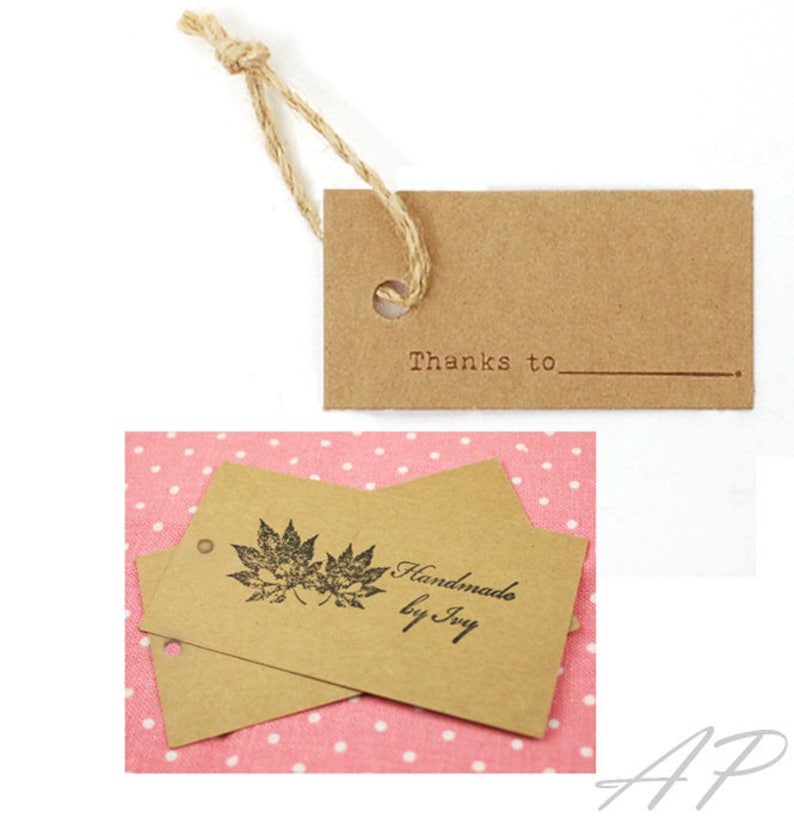 May include: Two brown kraft paper gift tags with twine string. One tag has the text "Thanks to" with a line underneath. The other tag has a black maple leaf design and the text "Handmade by Ivy".