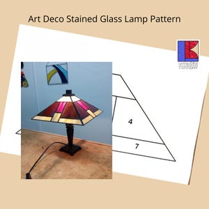 May include: A stained glass lamp with a geometric pattern in shades of brown, pink, and white. The lamp is on a table and has a black cord. The image also includes a diagram of the lamp's pattern with measurements in inches.