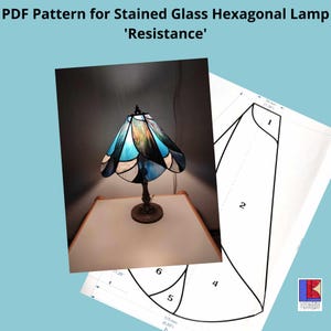 May include: A stained glass hexagonal lampshade pattern with six pieces labeled 1-6. The lampshade is blue, white, and black. The pattern is for a lamp called 'Resistance'.