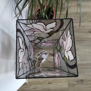 Pattern on a stained glass quadrilateral lamp Magnolia