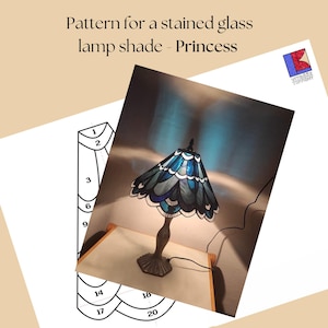 May include: A stained glass lamp with a blue and white shade, labelled "Princess." The lamp has a dark bronze base and a matching finial. The image also includes a pattern for the lamp shade with numbered sections.