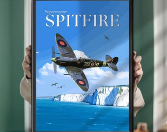 May include: A framed poster featuring a Supermarine Spitfire aircraft flying over white cliffs and blue water. The text Supermarine SPITFIRE is printed in white at the top. The aircraft has circular red, white, and blue markings on its wings.