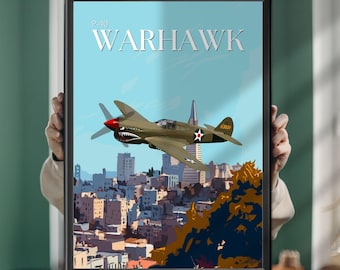 May include: A framed poster featuring a P-40 Warhawk airplane flying over a city skyline. The plane is olive green with a red nose and shark teeth graphic. The text P-40 WARHAWK is printed in white at the top against a light blue sky background.