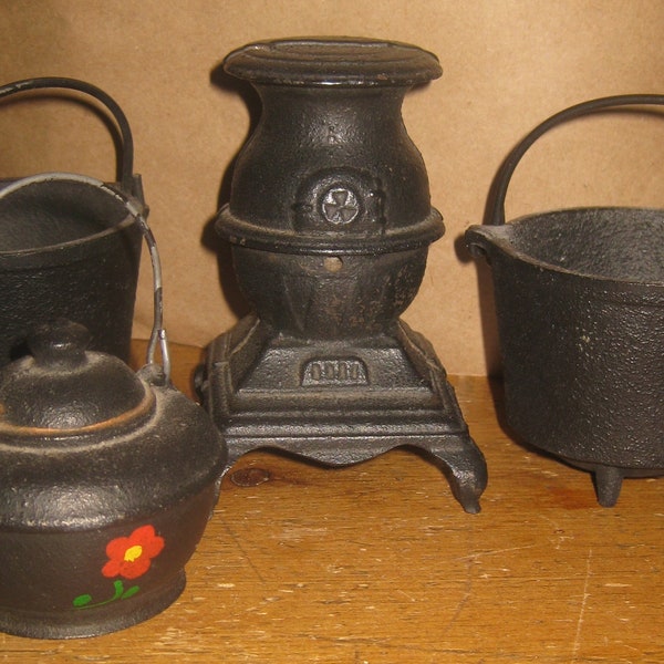 Four "Canada Forge" Cast Iron Miniatures: Wood Stove Coin Bank, Tea Kettle, More